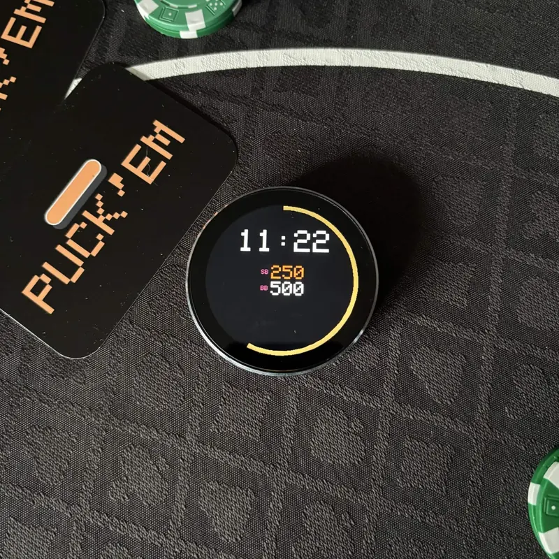 PUCK’em tournament clock showing 11:22 left with blinds of 250 and 500 next to poker chips